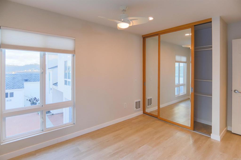 307 Shoemaker Lane Solana Beach, CA 92075 - Photo 21 of 31 an empty room with wooden floor and a bathroom