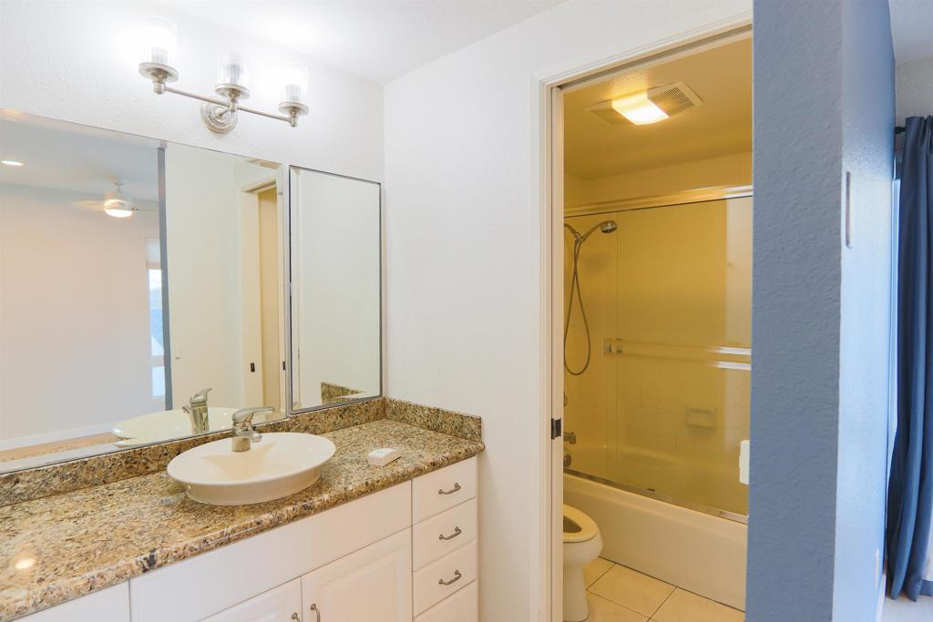 307 Shoemaker Lane Solana Beach, CA 92075 - Photo 24 of 31 a bathroom with a granite countertop sink and a mirror