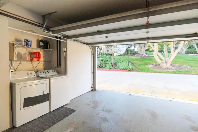 a kitchen with stainless steel appliances granite countertop a stove and a refrigerator