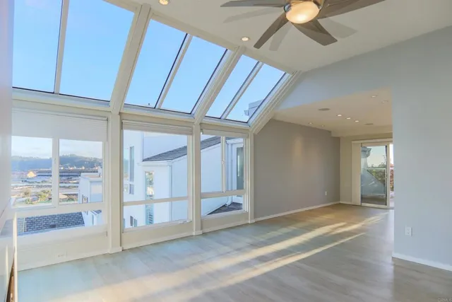 a view of an empty room with a window