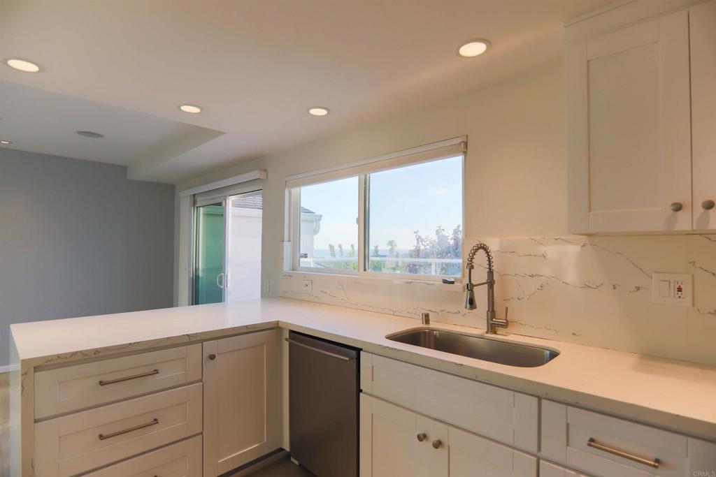 307 Shoemaker Lane Solana Beach, CA 92075 - Photo 5 of 31 a kitchen with a sink and large window