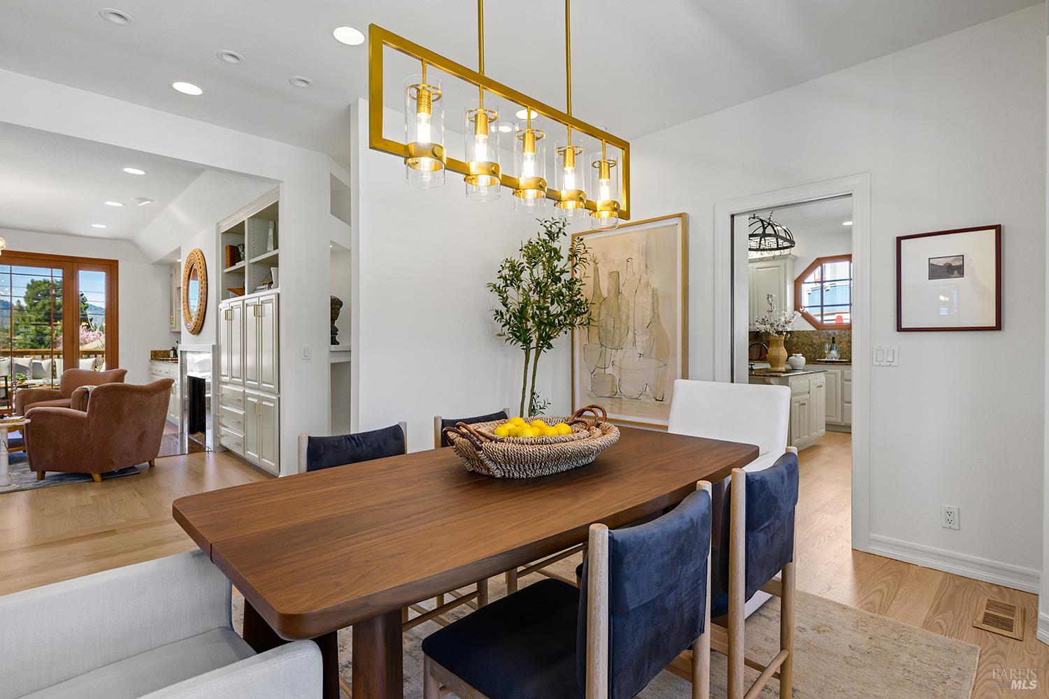 735 Johnson Street Healdsburg, CA 95448 - Photo 17 of 61 a view of a dining room with furniture and wooden floor