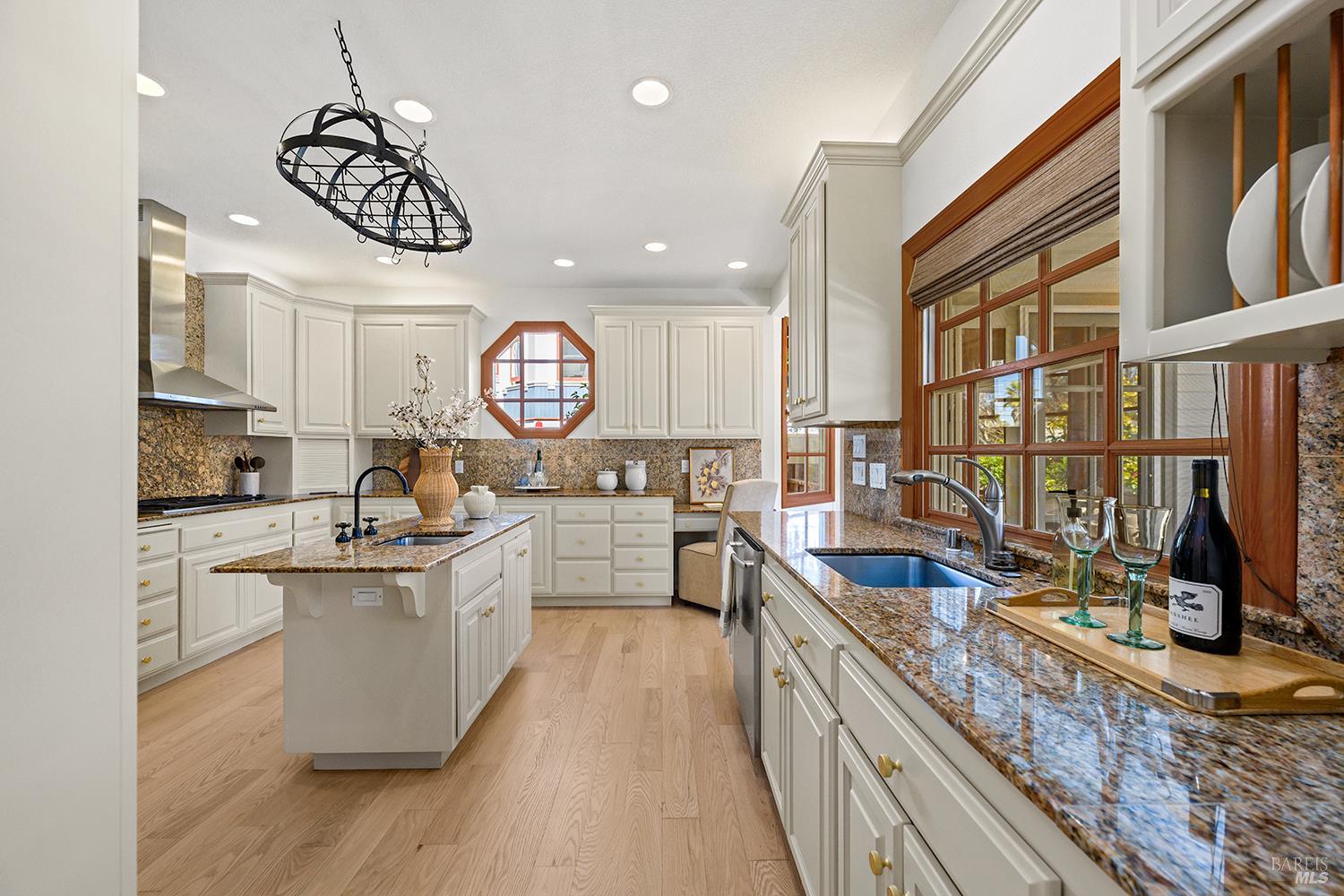 735 Johnson Street Healdsburg, CA 95448 - Photo 22 of 61 a kitchen with a sink stove and cabinets