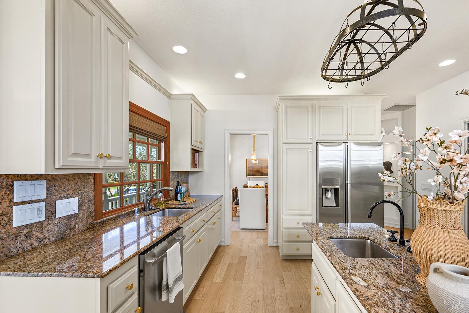 735 Johnson Street Healdsburg, CA 95448 - Photo 23 of 61 a kitchen with stainless steel appliances granite countertop a sink stove and refrigerator