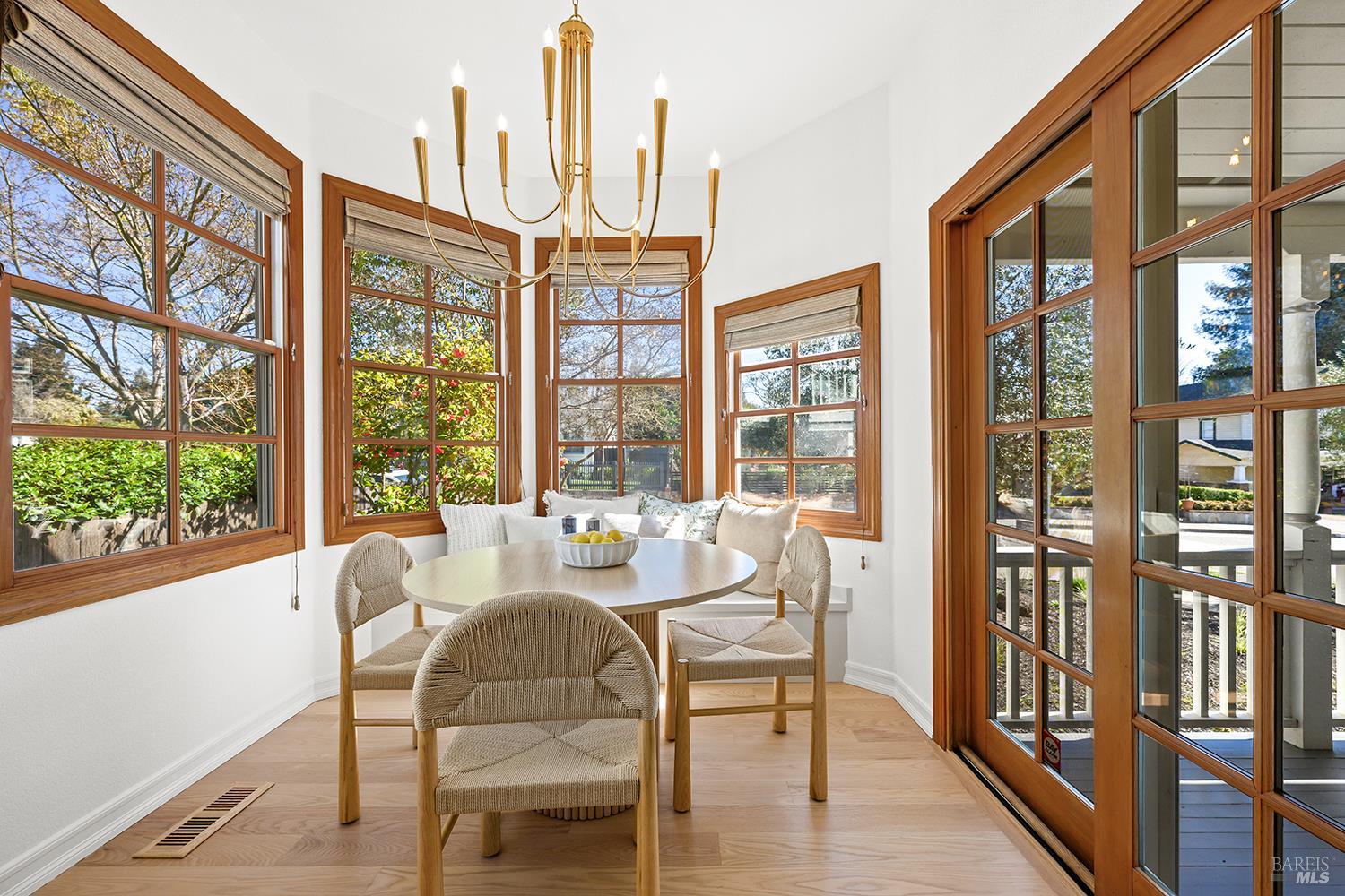 735 Johnson Street Healdsburg, CA 95448 - Photo 26 of 61 a dining room with furniture water view and large windows