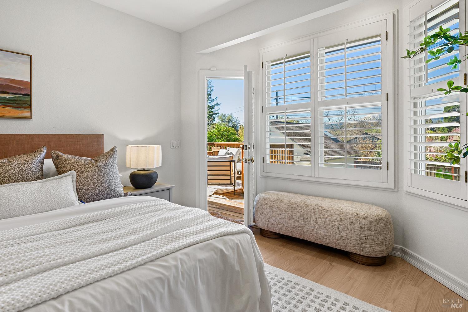 735 Johnson Street Healdsburg, CA 95448 - Photo 30 of 61 a bedroom with a bed and a couch next to a window