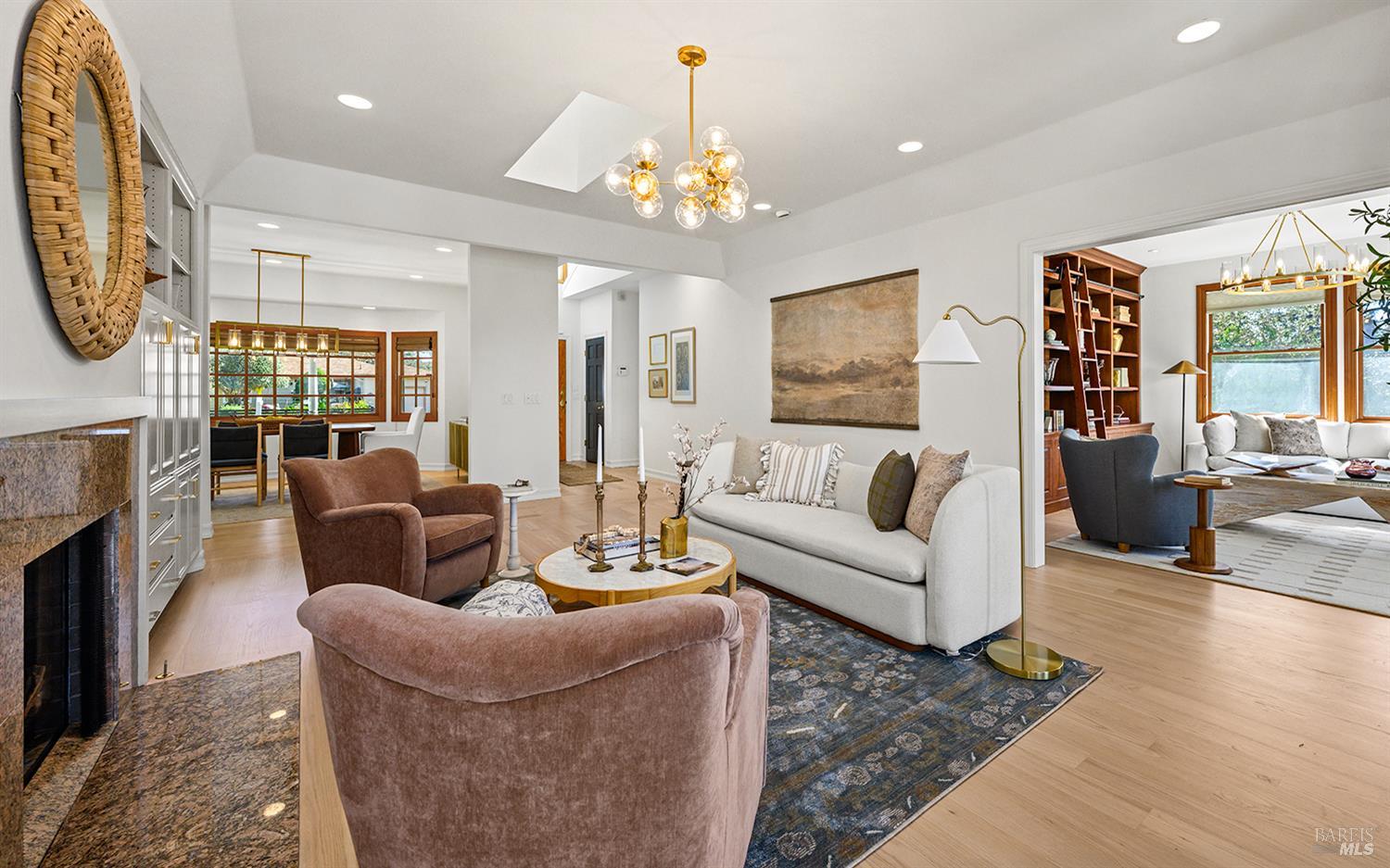 735 Johnson Street Healdsburg, CA 95448 - Photo 5 of 61 a living room with furniture a chandelier and a fireplace