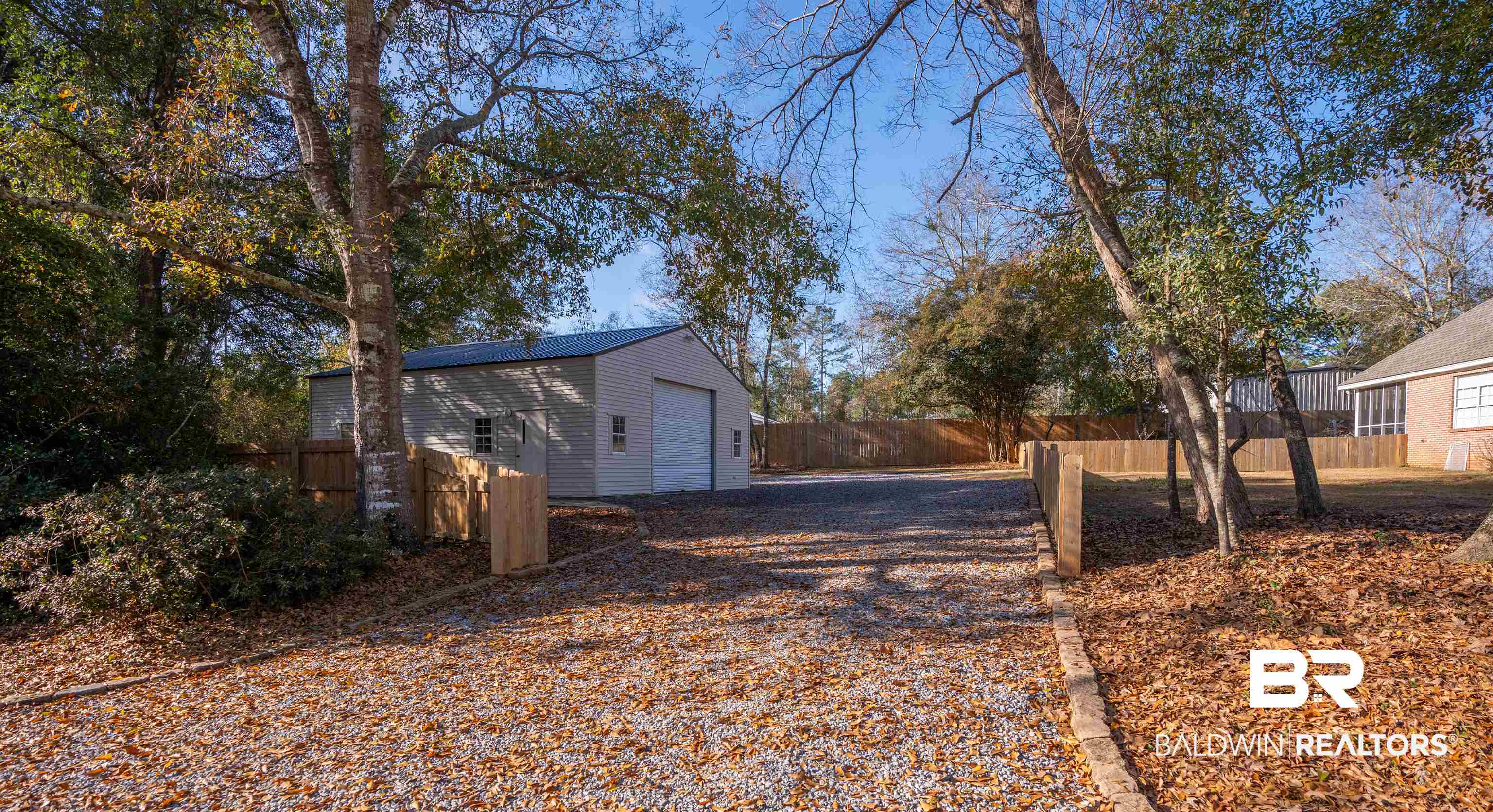 14631 Rdg Road East Summerdale, AL 36580 - Photo 36 of 46 Exterior space featuring a garage and an outbuilding