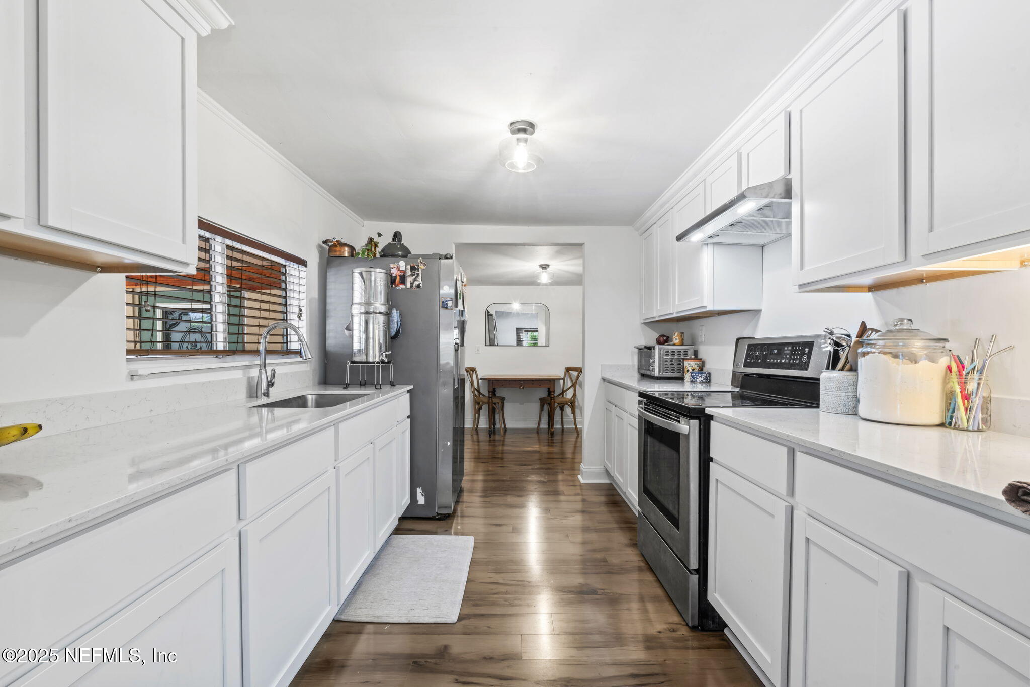 9160 Wild Road Jacksonville, FL 32220 - Photo 11 of 39 a kitchen with stainless steel appliances granite countertop a sink and cabinets