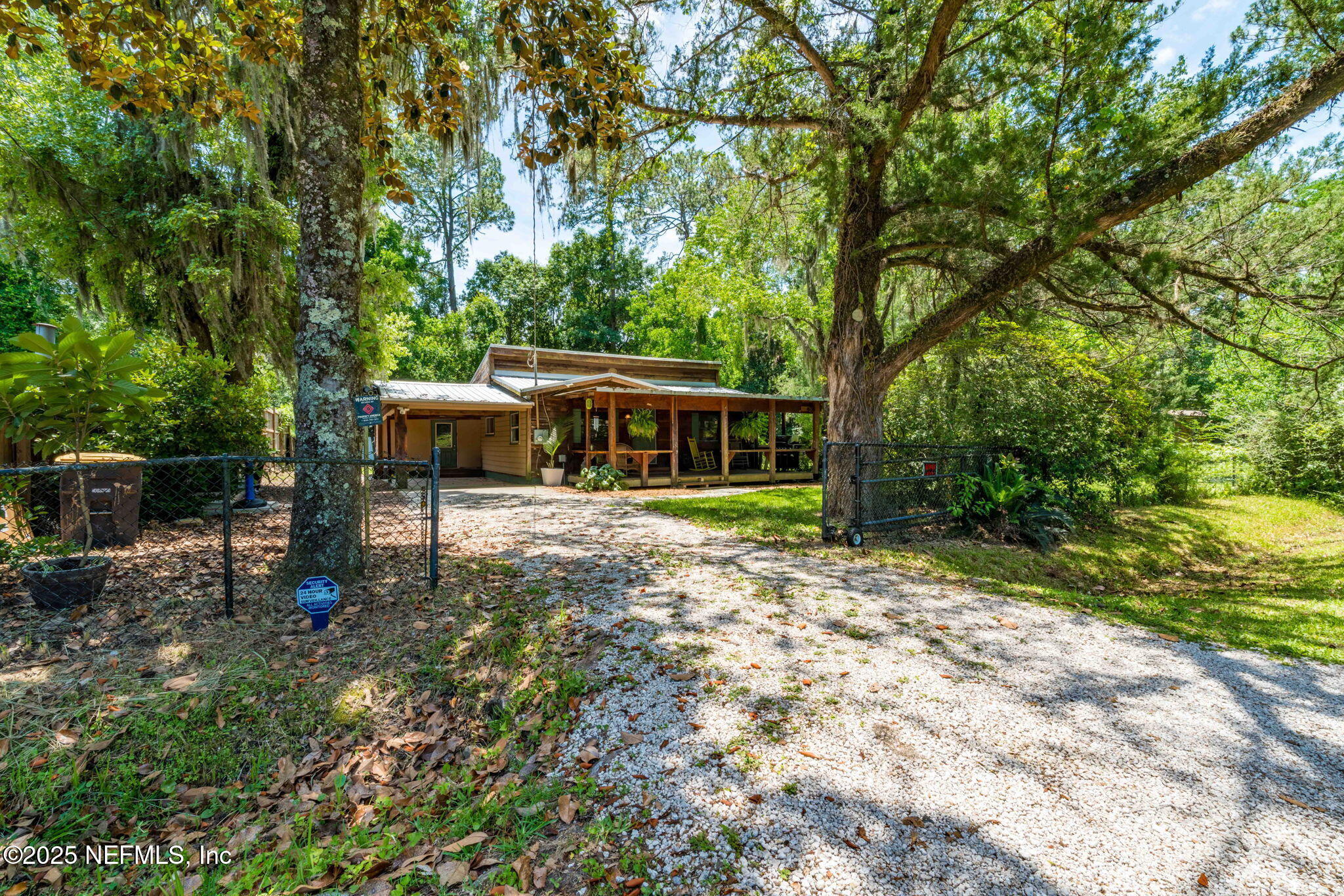 9160 Wild Road Jacksonville, FL 32220 - Photo 2 of 39 a front view of a house with a yard