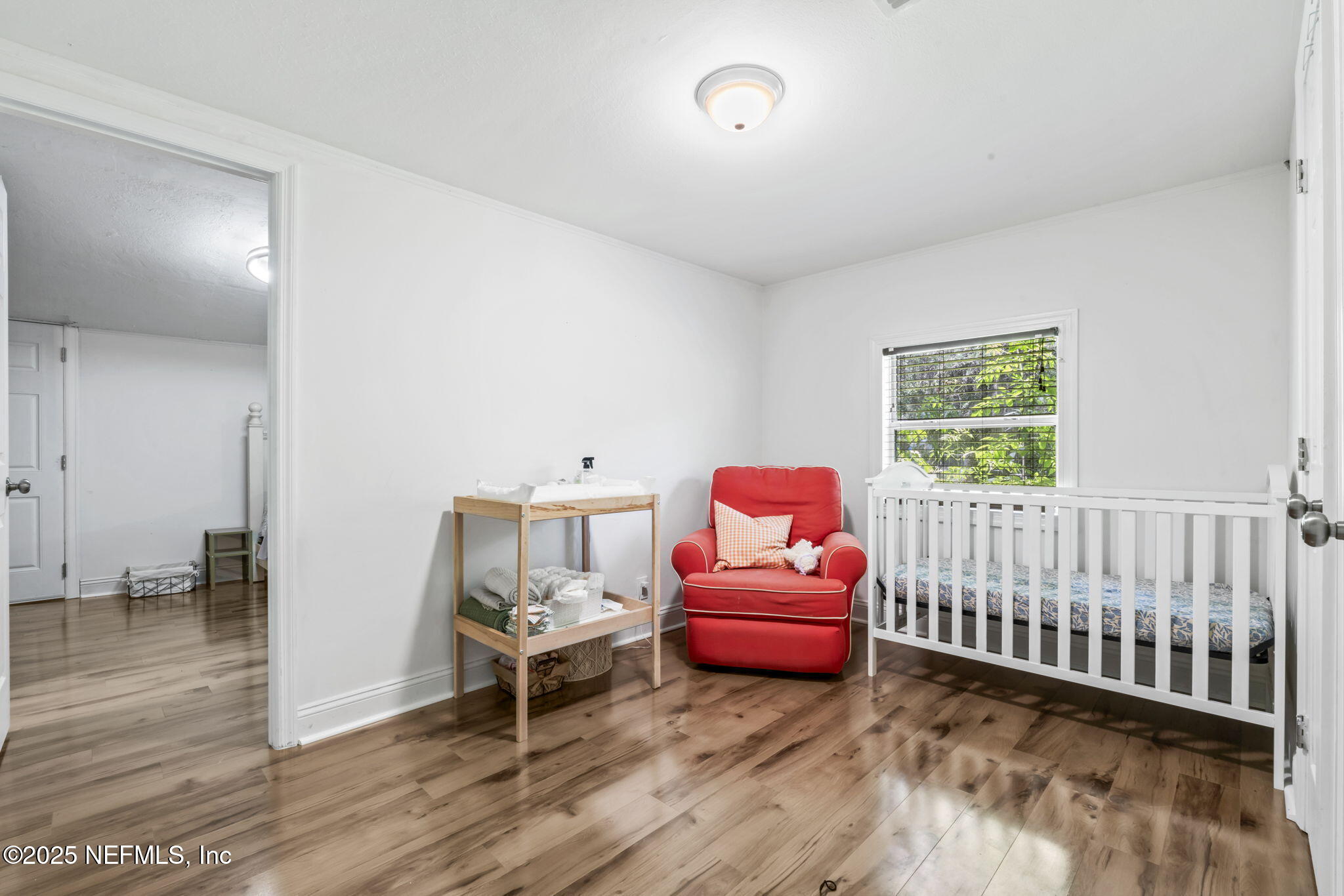 9160 Wild Road Jacksonville, FL 32220 - Photo 23 of 39 a bedroom with furniture and a window