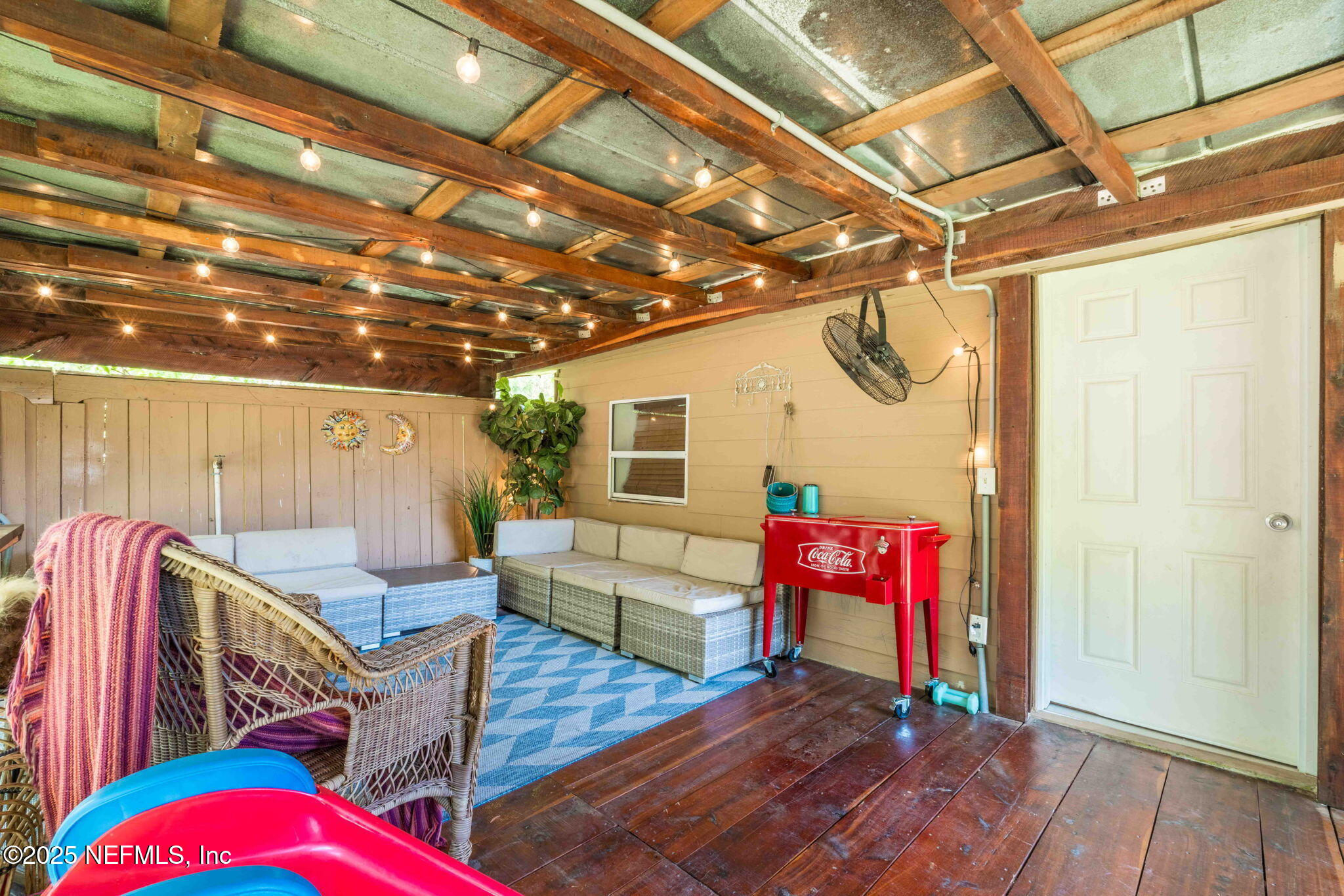 9160 Wild Road Jacksonville, FL 32220 - Photo 28 of 39 a outdoor space with lots of furniture and wooden floors