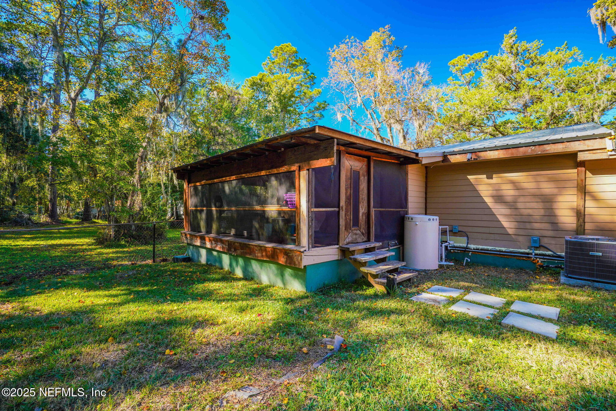9160 Wild Road Jacksonville, FL 32220 - Photo 30 of 39 a view of a house with a yard