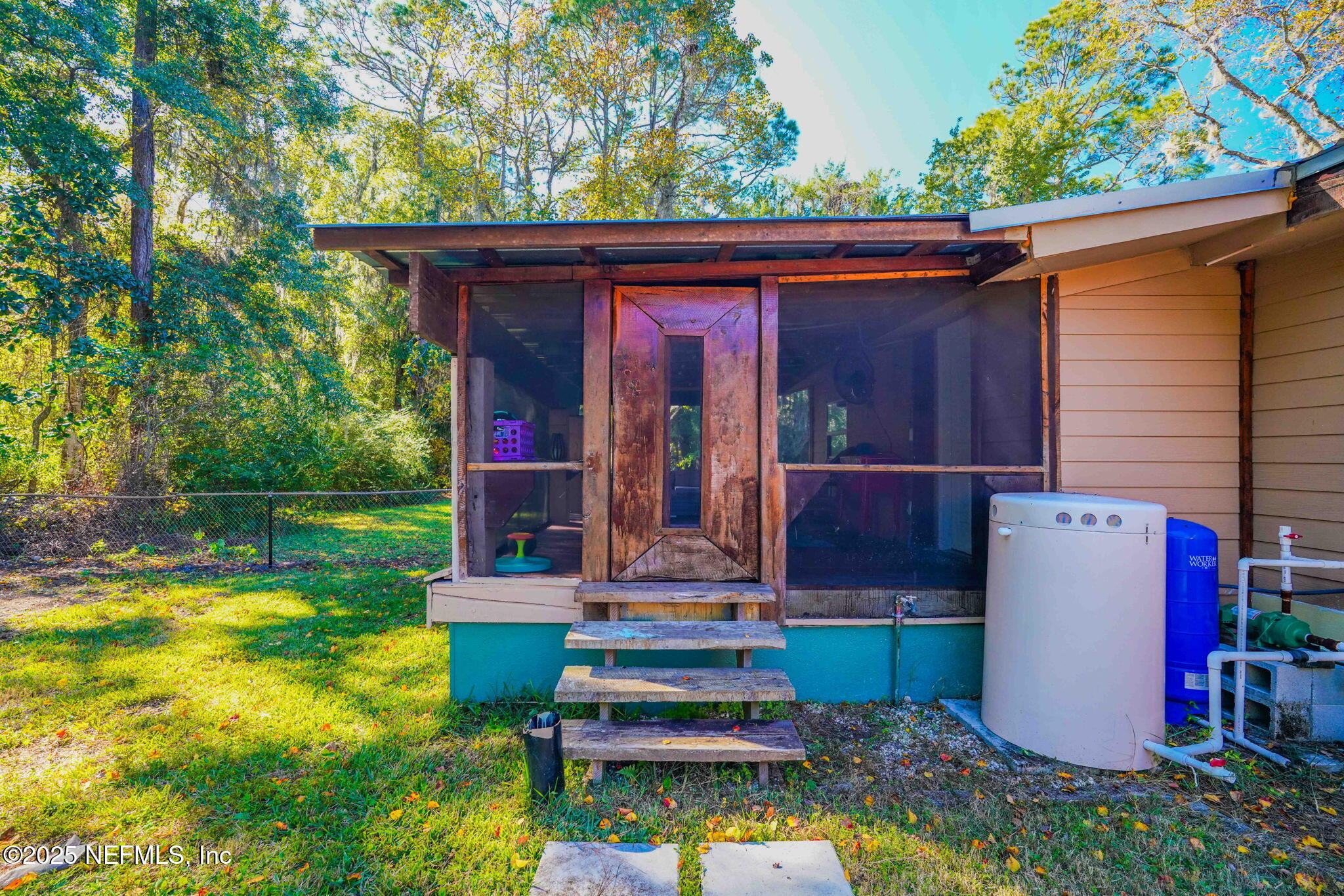 9160 Wild Road Jacksonville, FL 32220 - Photo 31 of 39 front view of house with a yard