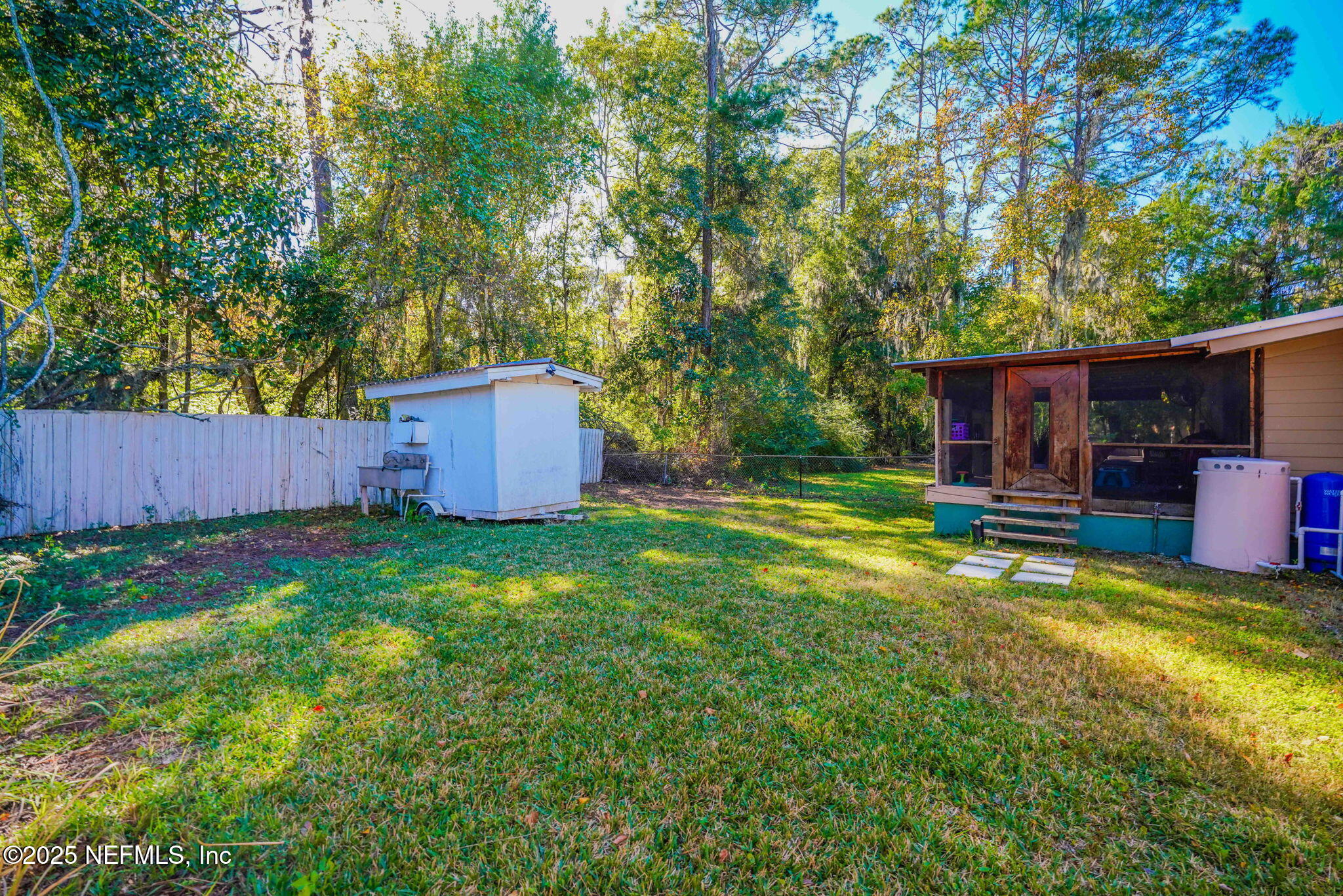 9160 Wild Road Jacksonville, FL 32220 - Photo 33 of 39 a backyard of a house with seating space