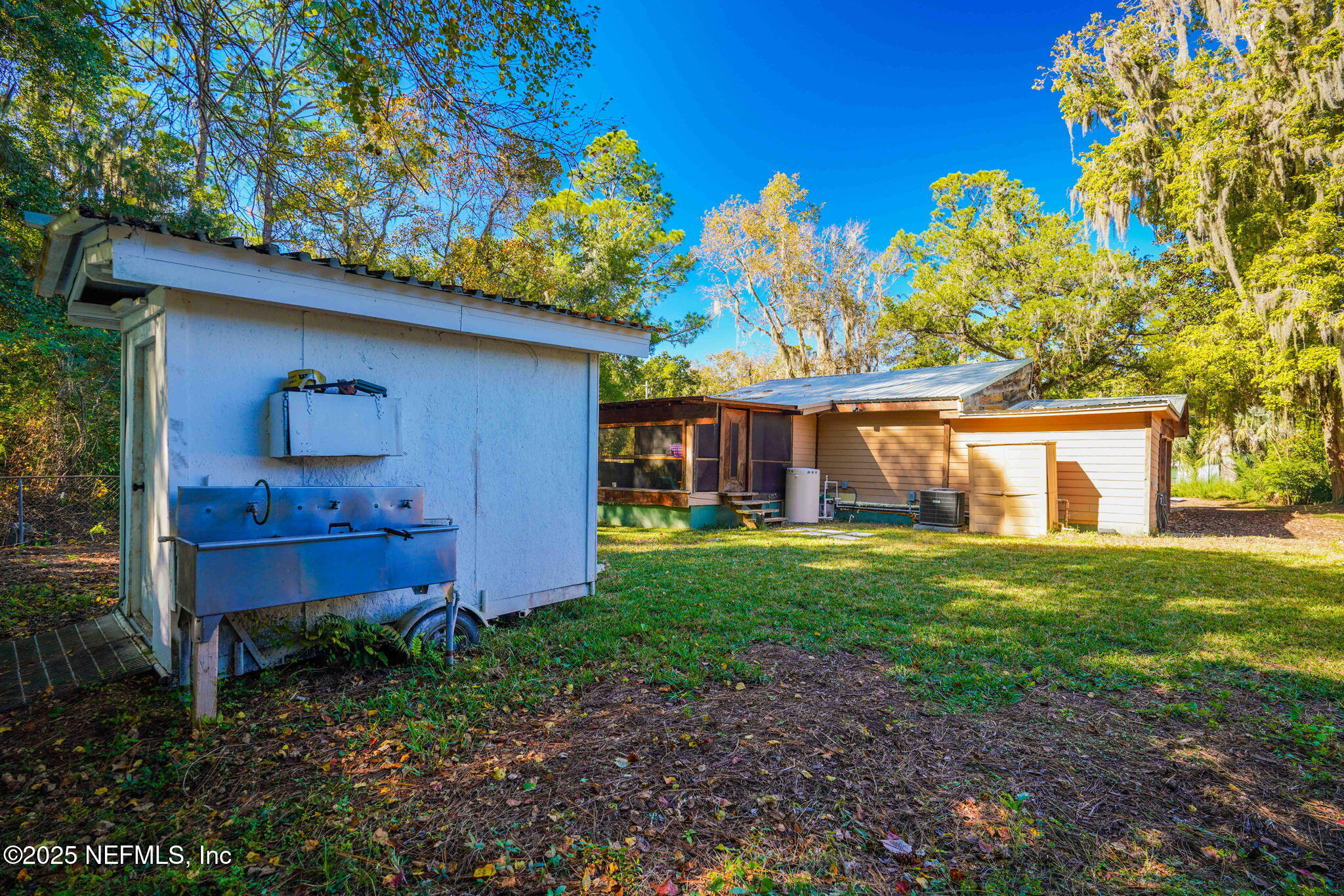 9160 Wild Road Jacksonville, FL 32220 - Photo 35 of 39 a front view of a house with garden