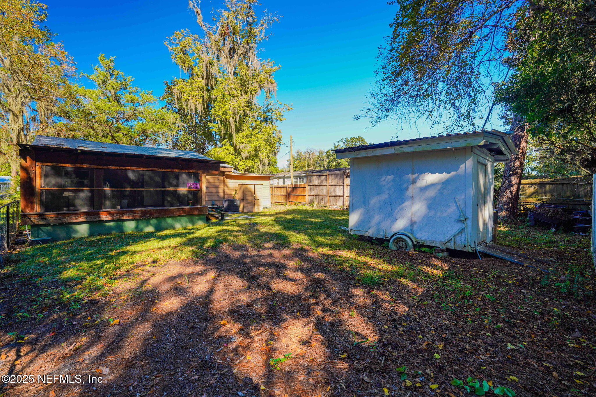 9160 Wild Road Jacksonville, FL 32220 - Photo 36 of 39 a backyard of a house with lots of green space