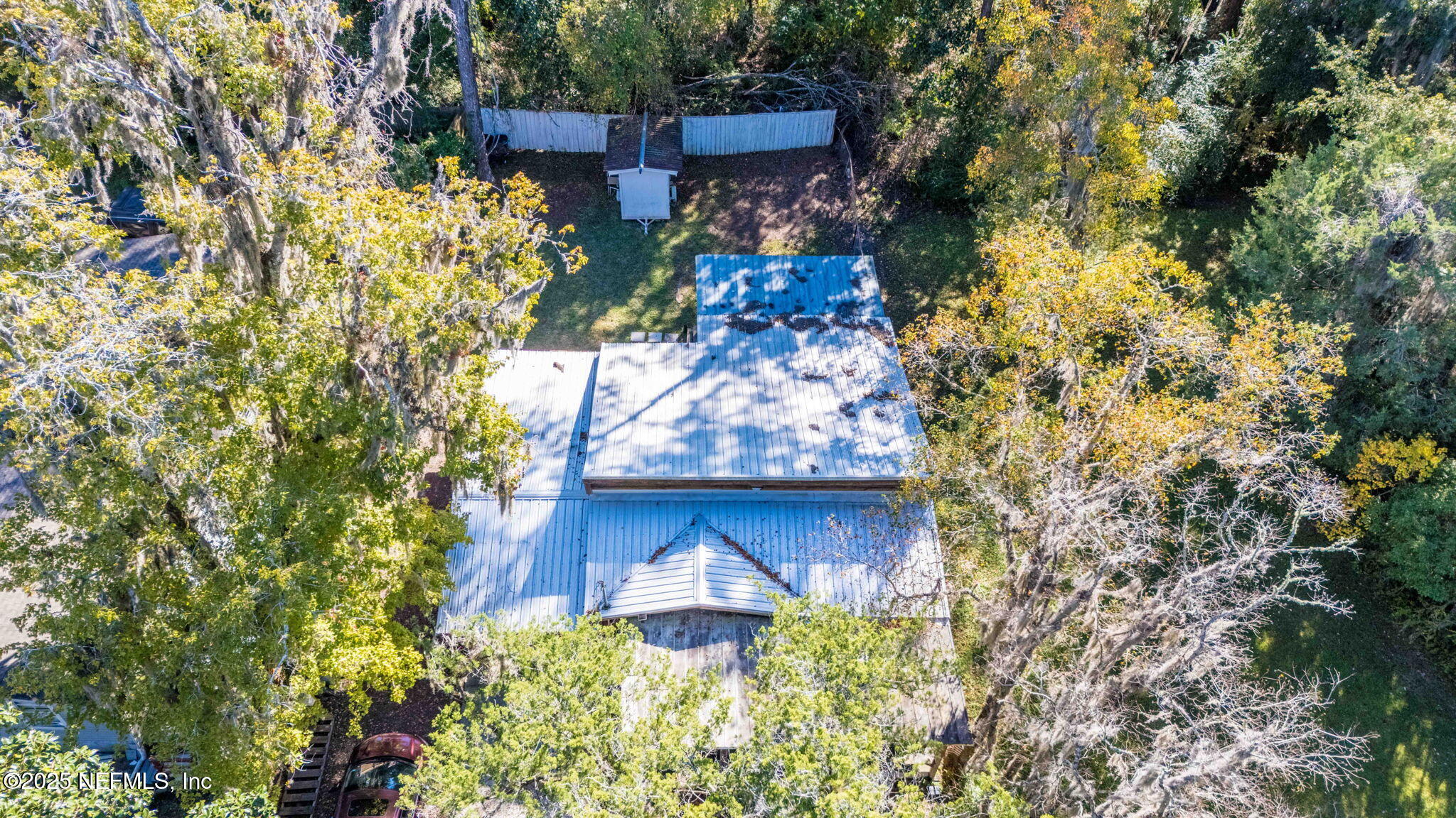 9160 Wild Road Jacksonville, FL 32220 - Photo 38 of 39 a stone house with a yard and garden