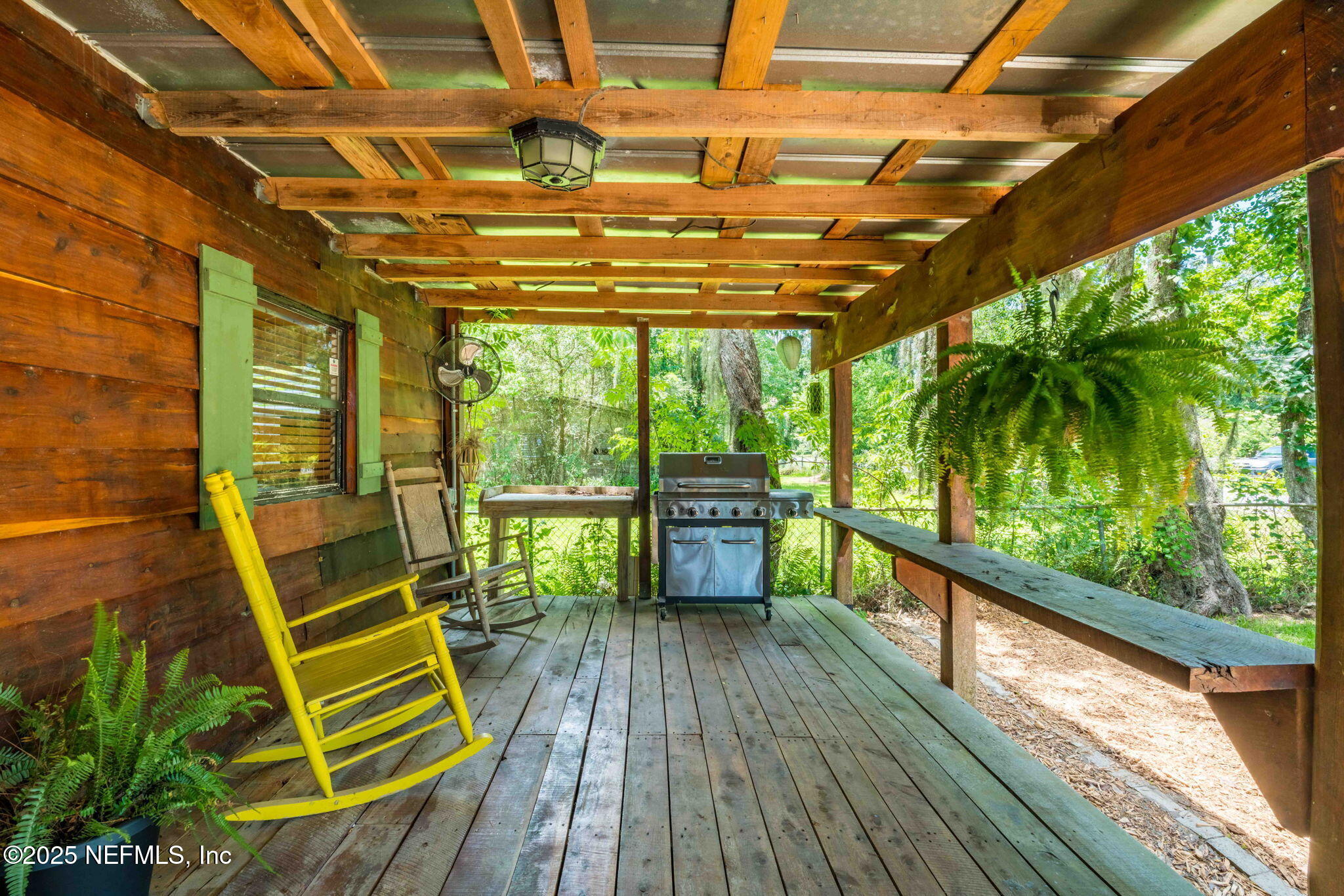 9160 Wild Road Jacksonville, FL 32220 - Photo 5 of 39 a view of a balcony with wooden floor