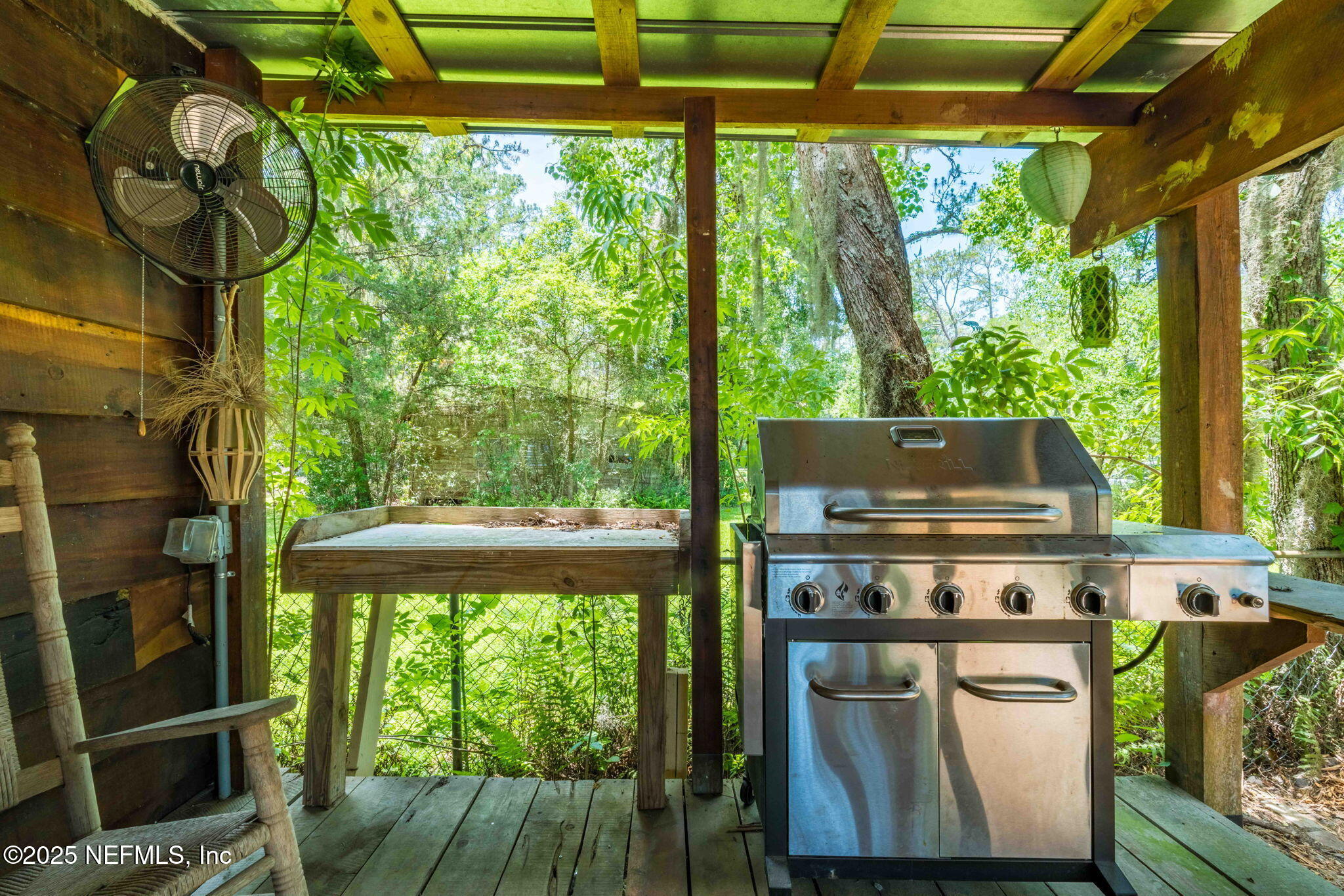 9160 Wild Road Jacksonville, FL 32220 - Photo 6 of 39 a kitchen with a stove and a large window