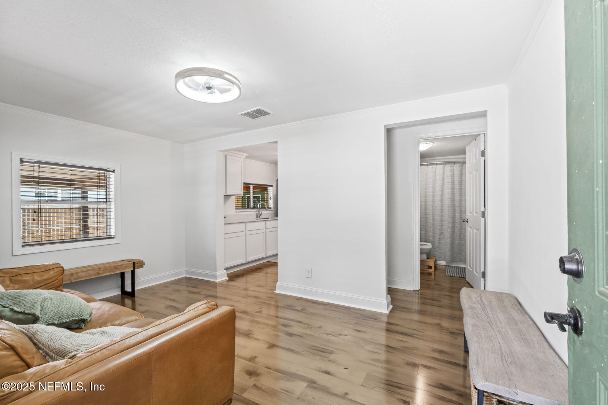 9160 Wild Road Jacksonville, FL 32220 - Photo 9 of 39 a living room with furniture and a window