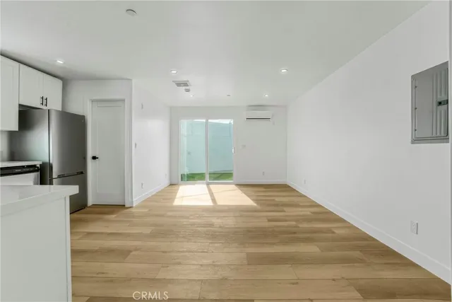 a bathroom with a granite countertop bathtub shower sink vanity and toilet