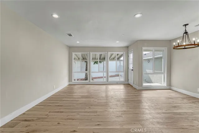 a bathroom with a sink a toilet a shower and a mirror