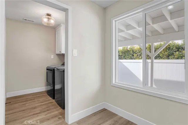 a bathroom with a granite countertop sink and a bathtub