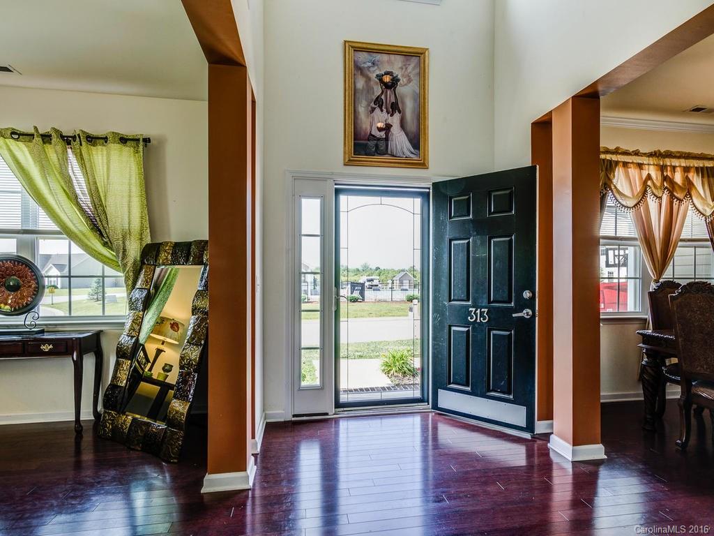313 Roanoke Road Fletcher, NC 28732 - Photo 2 of 24 a view of an entryway with wooden floor and windows