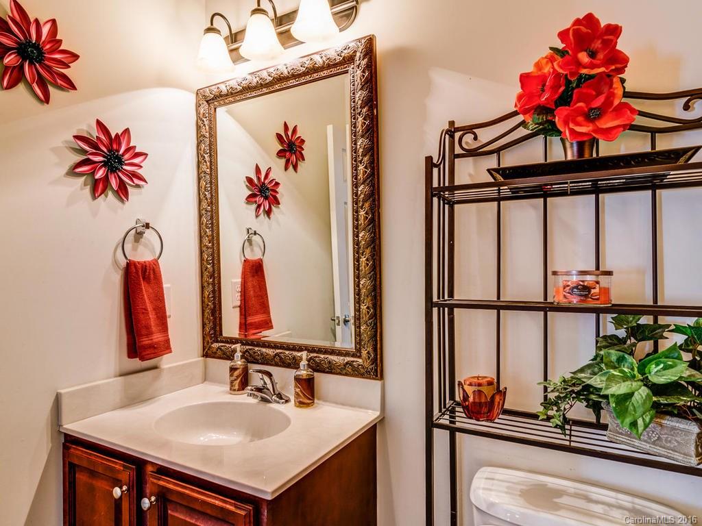 313 Roanoke Road Fletcher, NC 28732 - Photo 11 of 24 a bathroom with a sink mirror and vanity