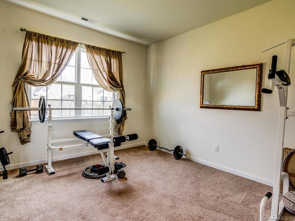 313 Roanoke Road Fletcher, NC 28732 - Photo 12 of 24 a room with gym equipment and a large window