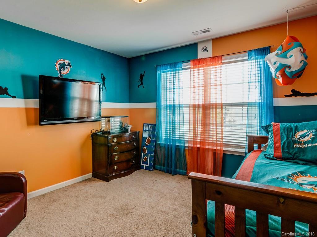 313 Roanoke Road Fletcher, NC 28732 - Photo 14 of 24 a living room with furniture and a flat screen tv