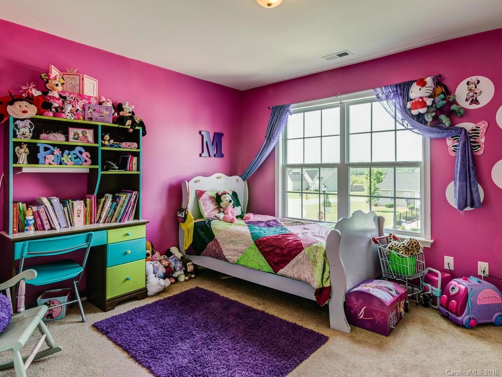 313 Roanoke Road Fletcher, NC 28732 - Photo 22 of 24 a bedroom with furniture and a window