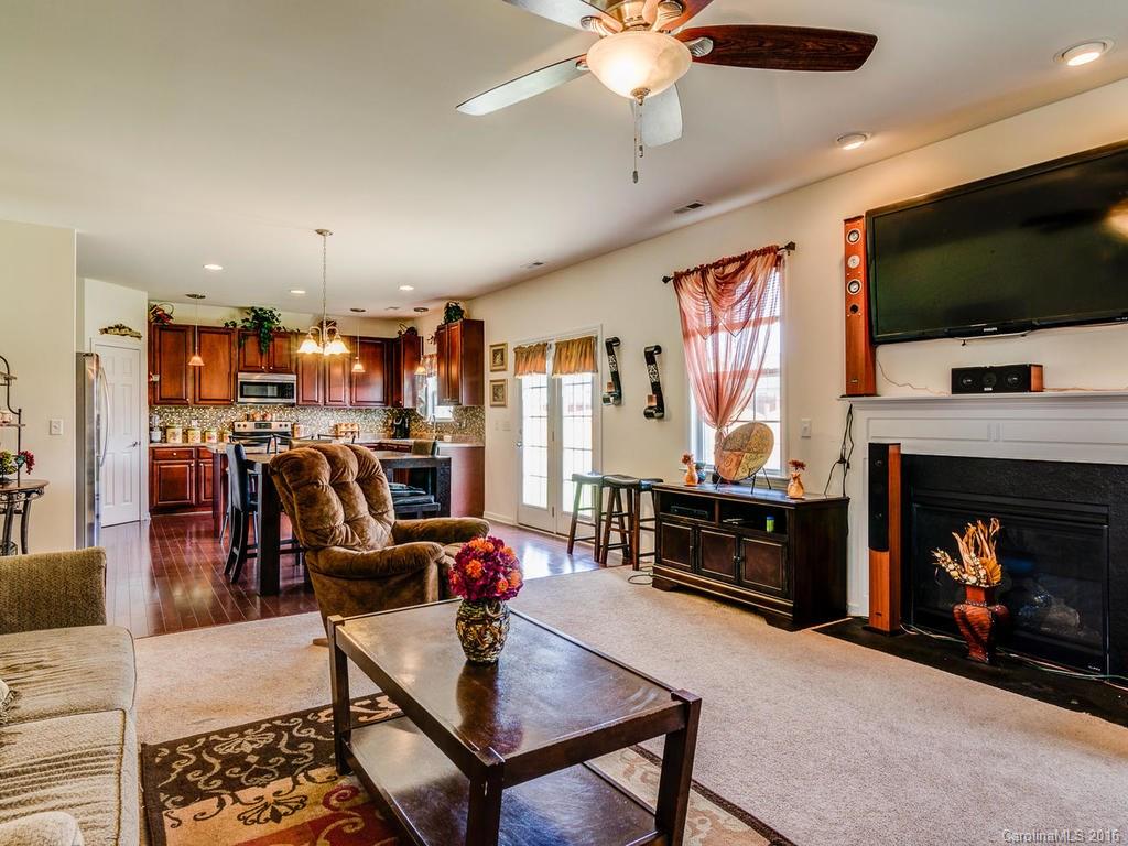 313 Roanoke Road Fletcher, NC 28732 - Photo 5 of 24 a living room with furniture and a flat screen tv