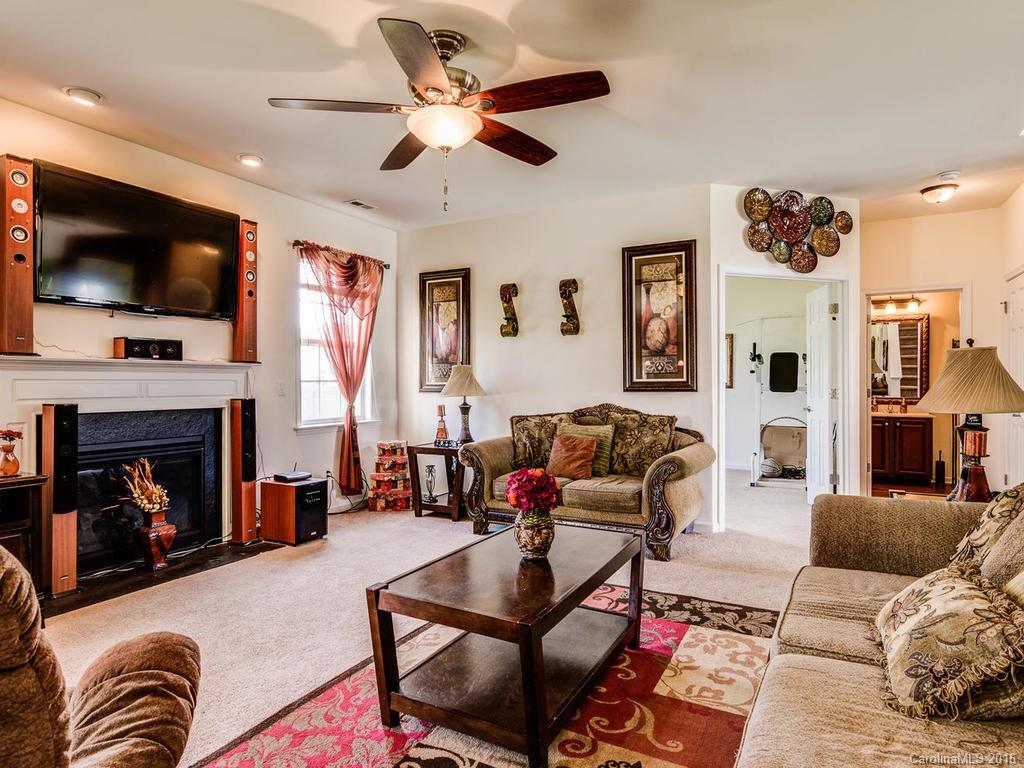 313 Roanoke Road Fletcher, NC 28732 - Photo 6 of 24 a living room with furniture and a flat screen tv