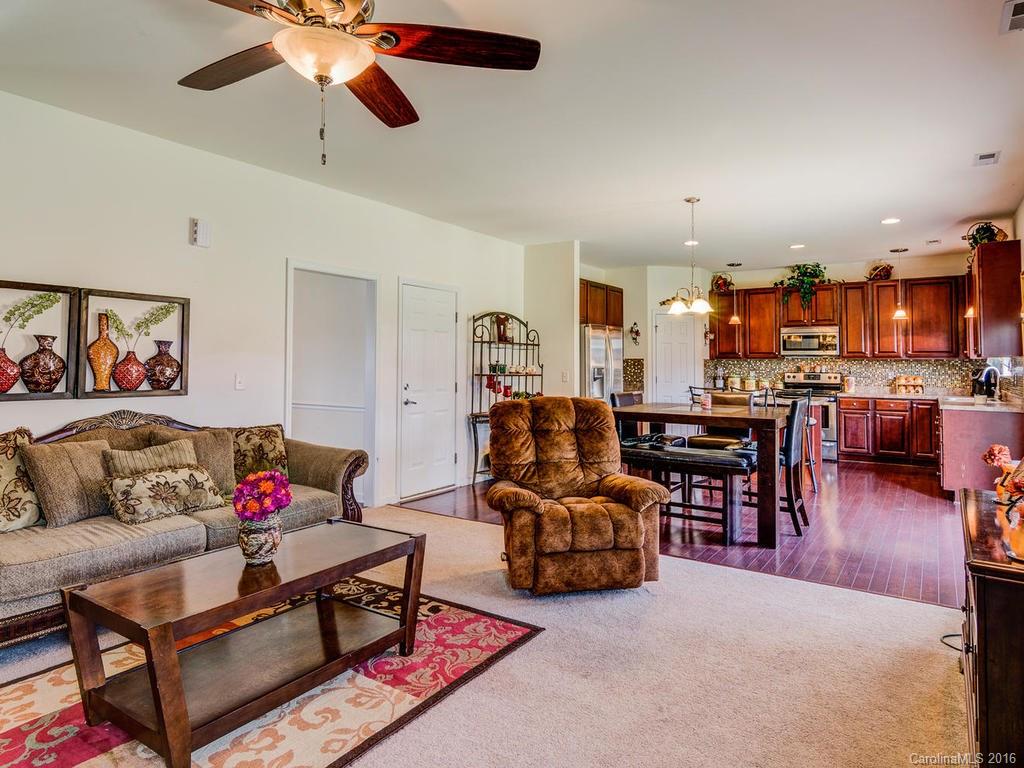 313 Roanoke Road Fletcher, NC 28732 - Photo 7 of 24 a living room with furniture kitchen view and a chandelier