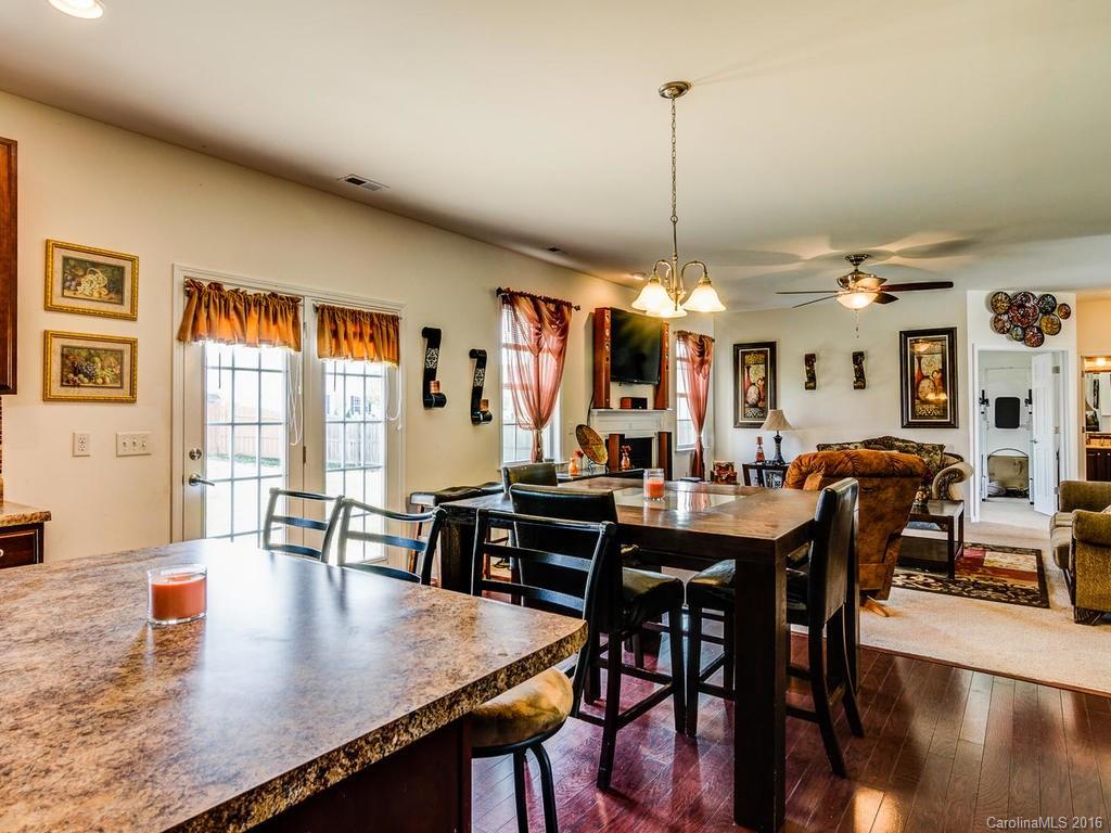 313 Roanoke Road Fletcher, NC 28732 - Photo 8 of 24 a view of a dining room with furniture window and wooden floor