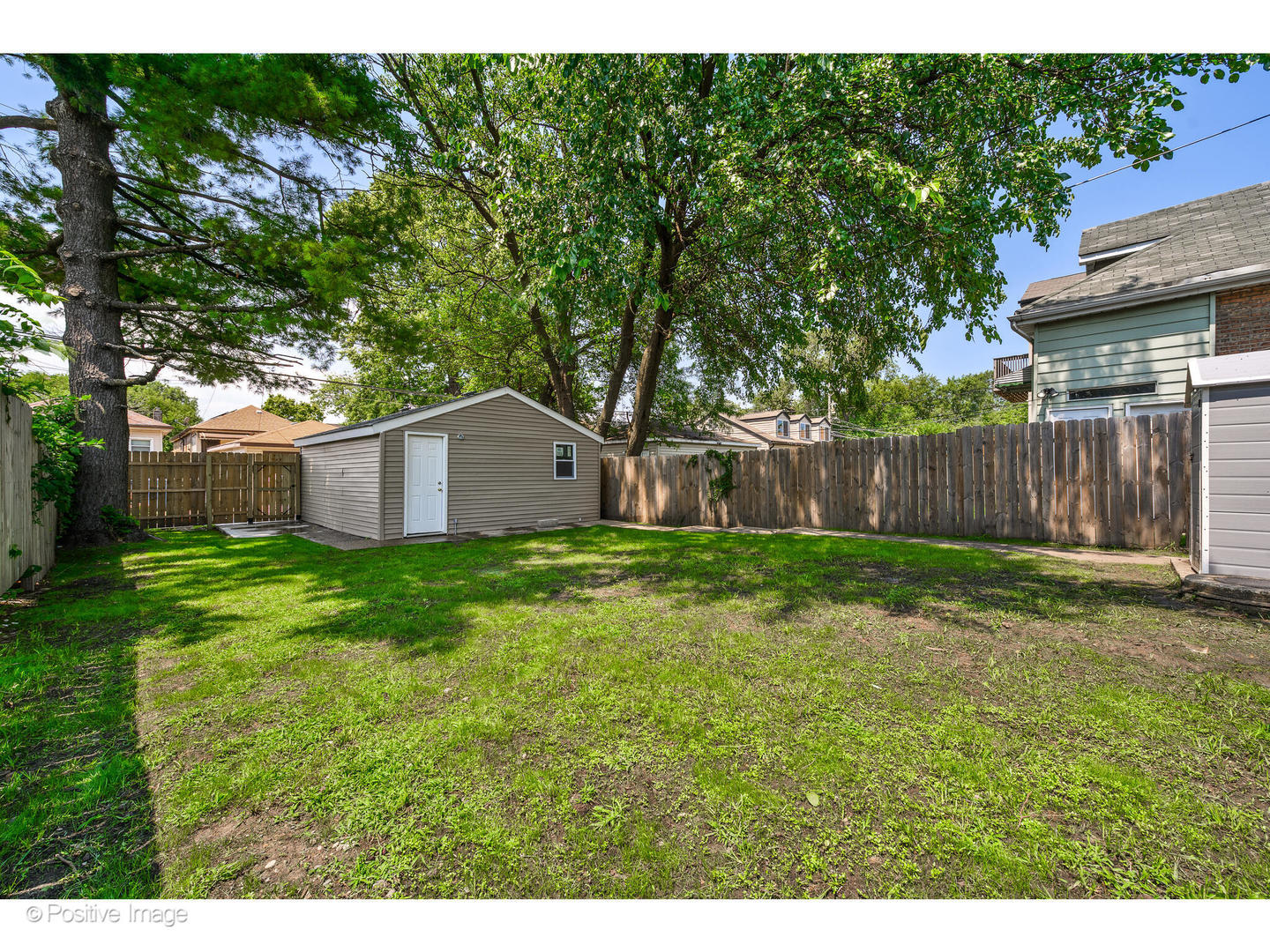 8446 South Constance Avenue Chicago, IL 60617 - Photo 12 of 14 a backyard of a house with lots of green space