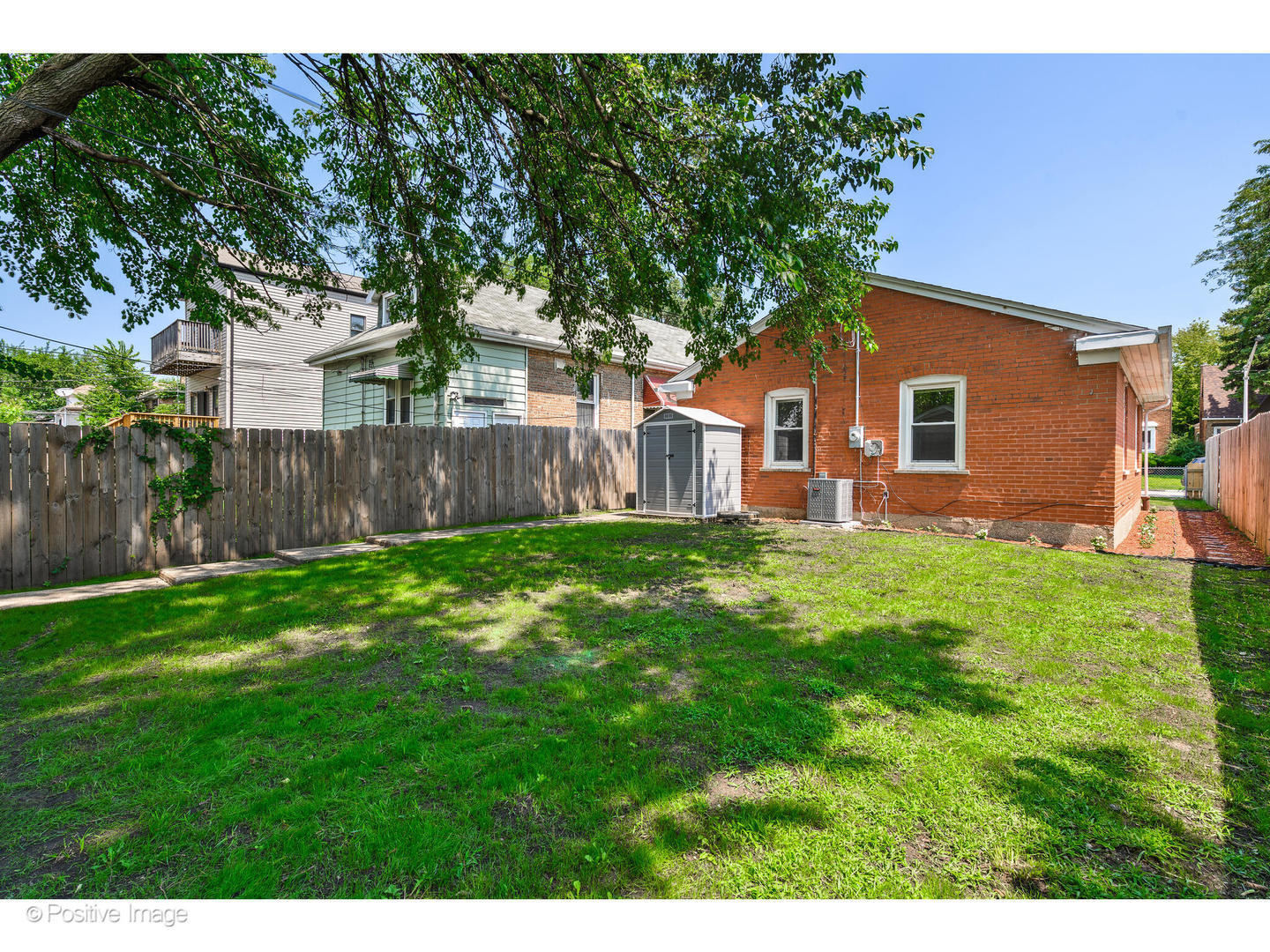 8446 South Constance Avenue Chicago, IL 60617 - Photo 13 of 14 a front view of house with yard and green space