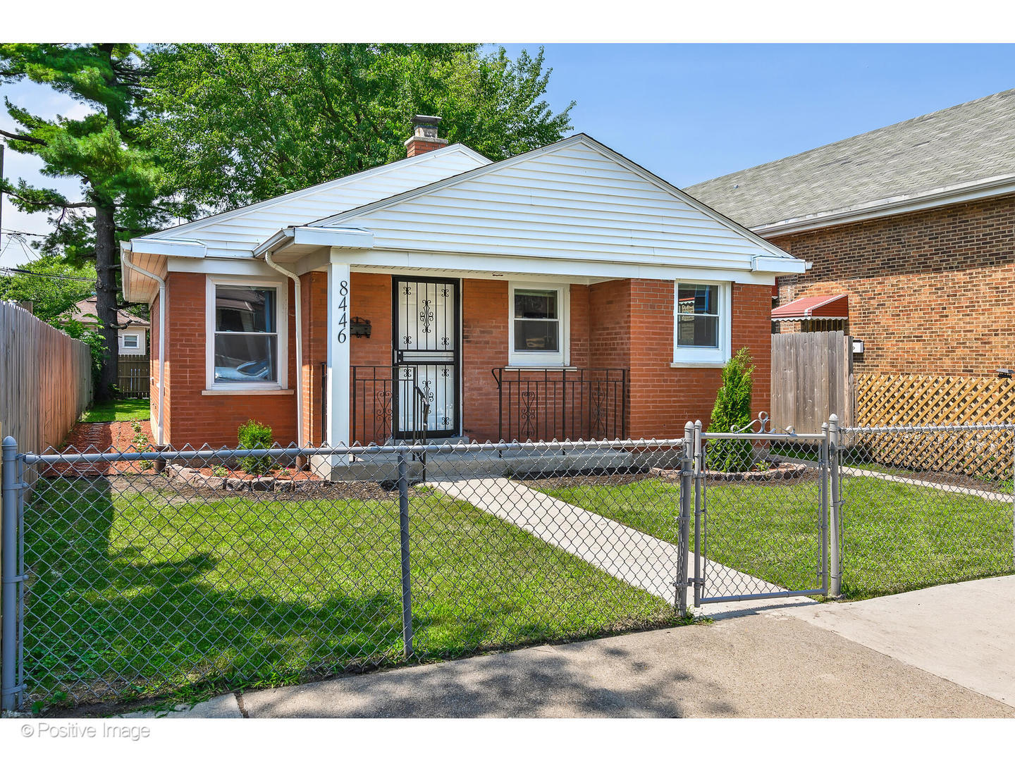 8446 South Constance Avenue Chicago, IL 60617 - Photo 2 of 14 a view of a house with a yard and sitting area