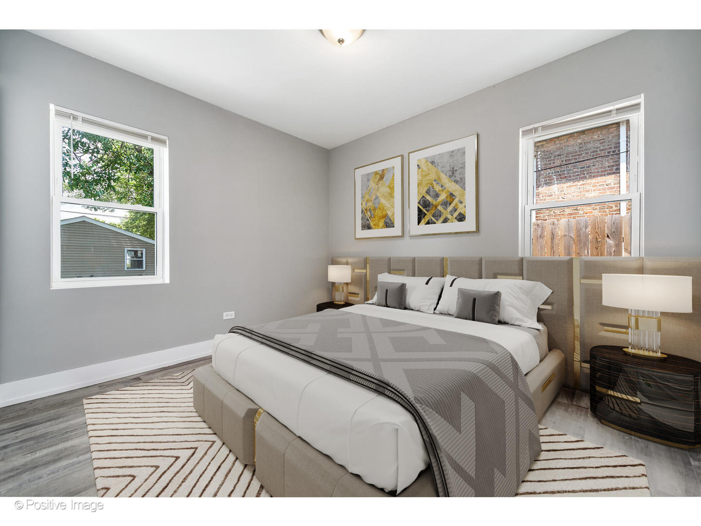 8446 South Constance Avenue Chicago, IL 60617 - Photo 8 of 14 a bedroom with a bed and a window