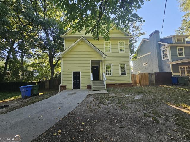 1018 Hubbard Street Southwest Atlanta, GA 30310 - Photo 1 of 1 a view of a house with a yard and tree s