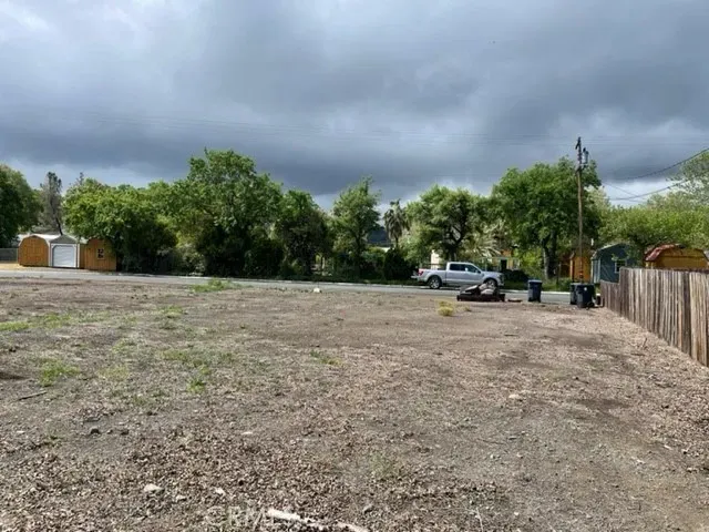 a view of street with parked cars
