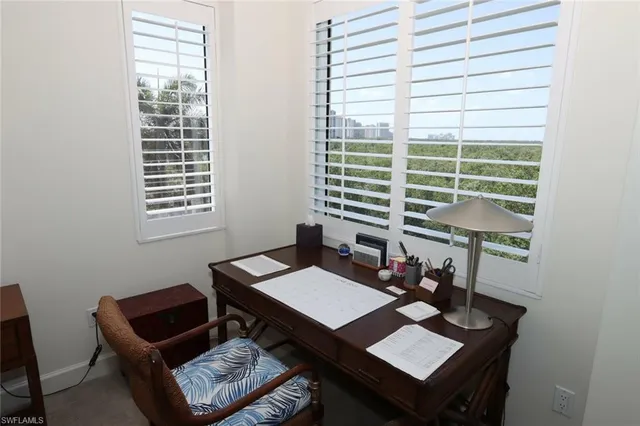 a reading room with furniture and a window