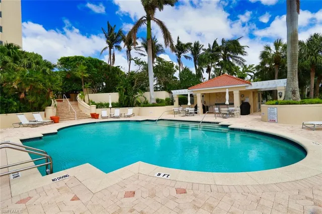 a view of a house with swimming pool and porch