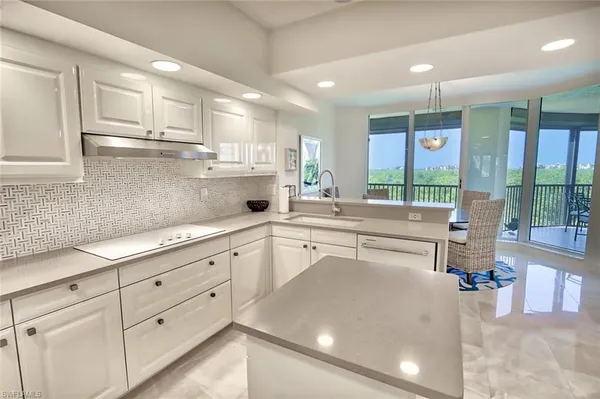 a kitchen with counter top space cabinets and stainless steel appliances