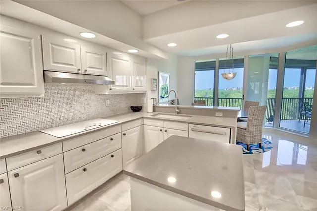 a kitchen with counter top space cabinets and stainless steel appliances