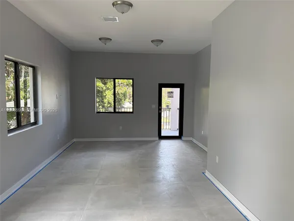 an empty room with windows