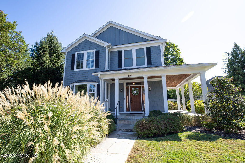 9 Center Road Old Greenwich, CT 06870 - Photo 1 of 26 a front view of a house with a garden