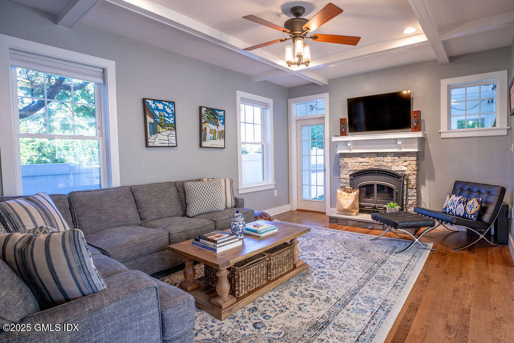 9 Center Road Old Greenwich, CT 06870 - Photo 11 of 26 a living room with furniture flat screen tv and a fireplace